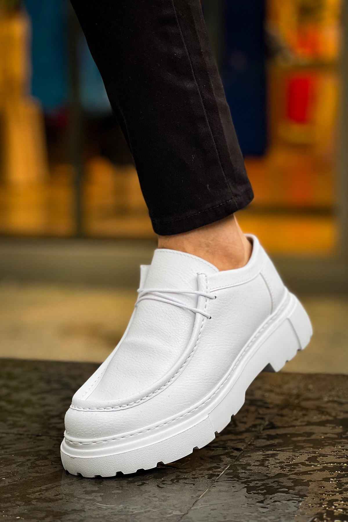Men's white leather-style lace-up shoes with low profile collar, close side view