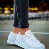 Men's white lace-up sneakers, angled side view with padded collar