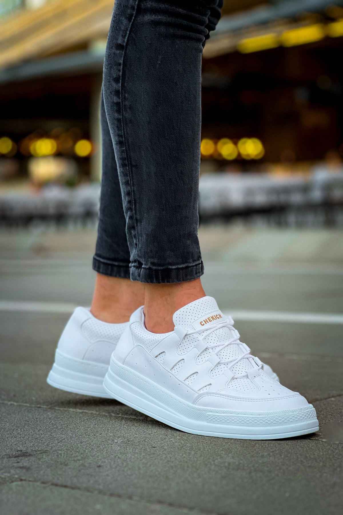 Men's white lace-up sneakers, angled side view with padded collar