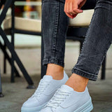 White lace-up sneakers with side logo detail and rubber cupsole