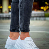 White low-cut lace-up sneakers with textured rubber sole