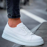White lace-up sneakers with side panel stitching and thick sole
