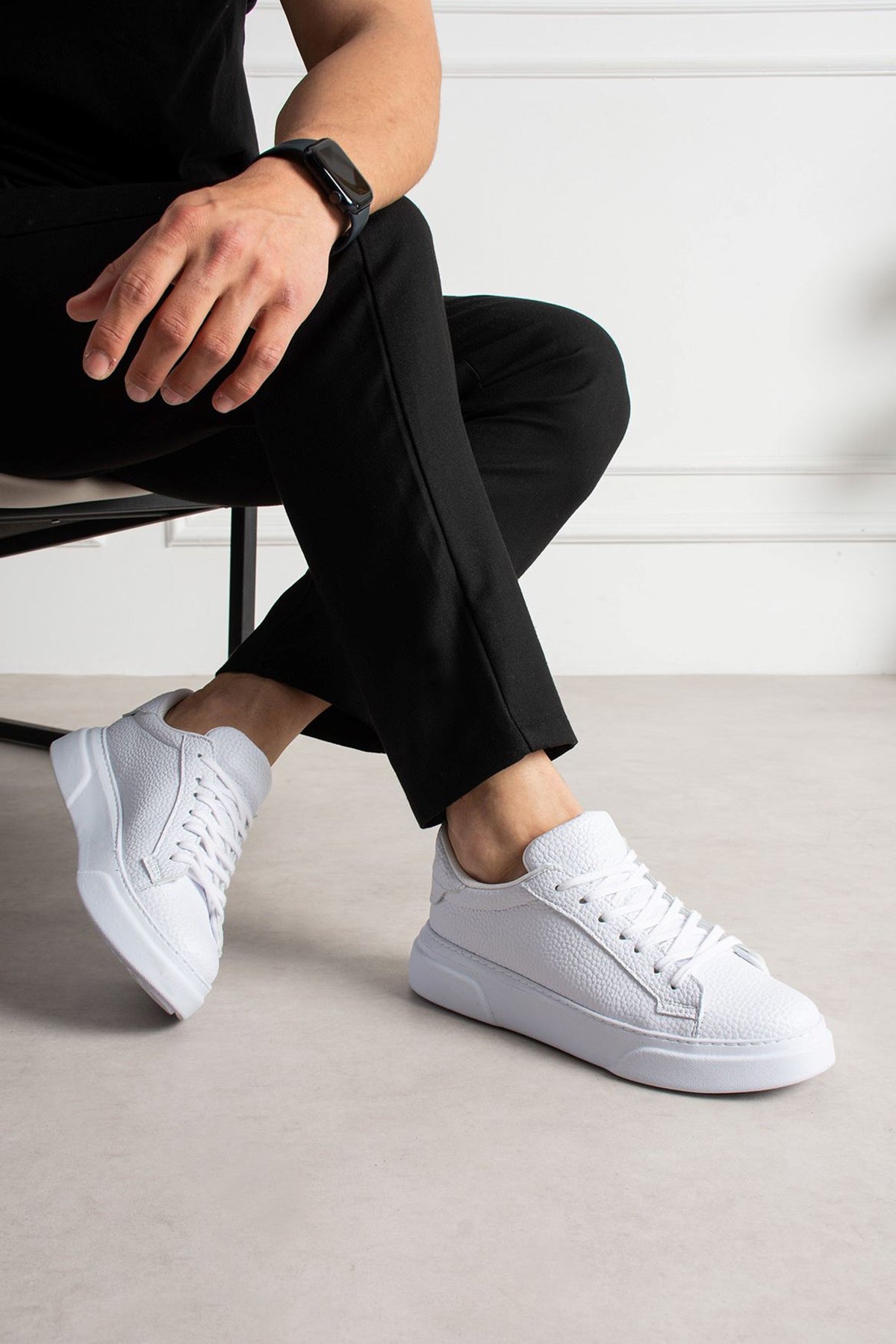 White lace-up low-top sneakers with cushioned collar and rubber sole
