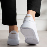 White lace-up sneakers with 'CHEKICH' heel logo and rubber outsole
