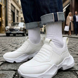 White sock-style sneakers with ribbed knit collar and thick white tread sole