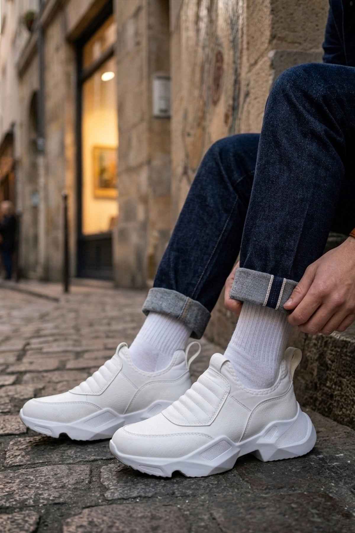 White sock sneakers with ribbed knit cuffs and chunky sole, street side view