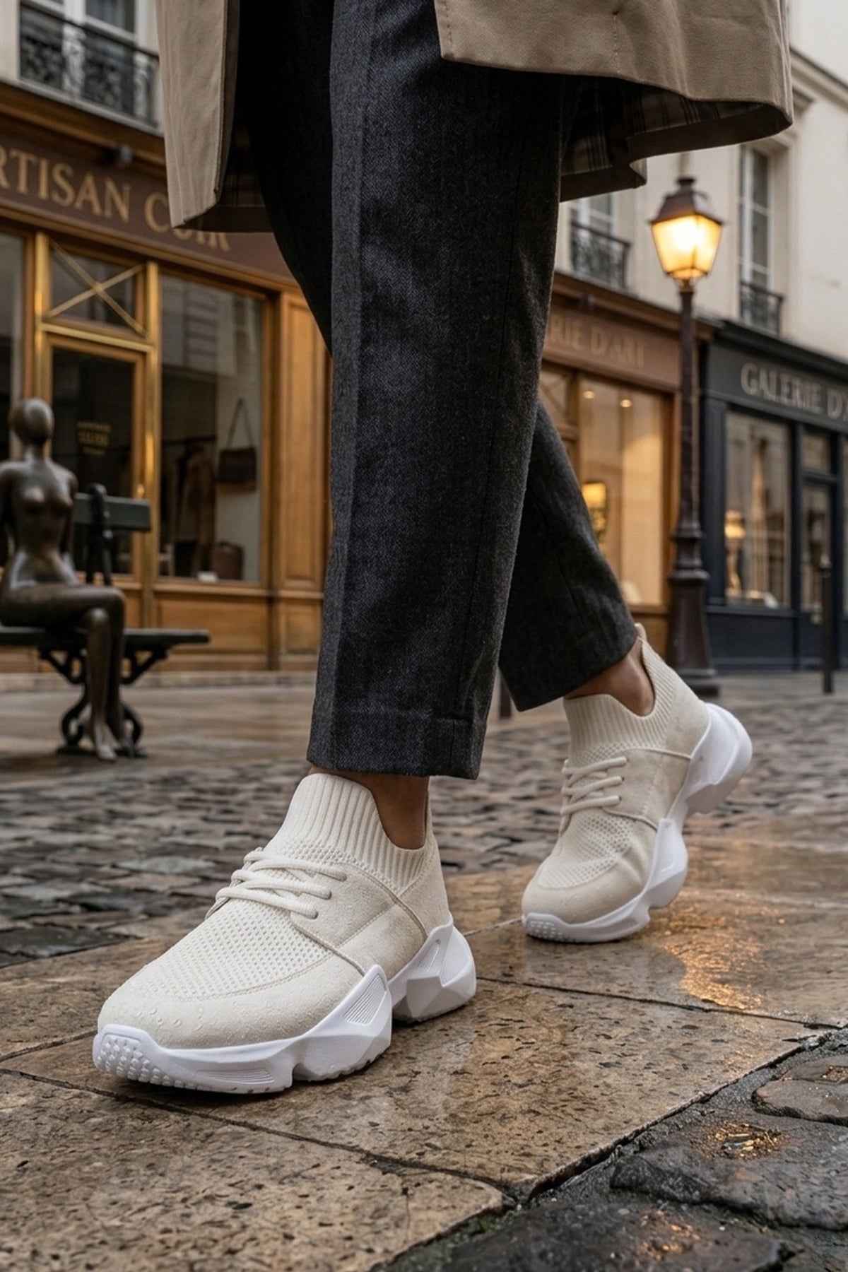 Men's white sneakers with lace-up style and chunky rubber sole with ribbed socks
