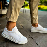 White low-top lace-up sneakers with smooth upper and white rubber outsole