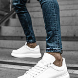 White low-top sneakers with lace-up front and stitched side panels