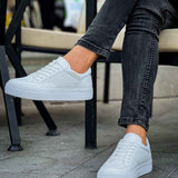 White lace-up sneakers with textured perforated panels