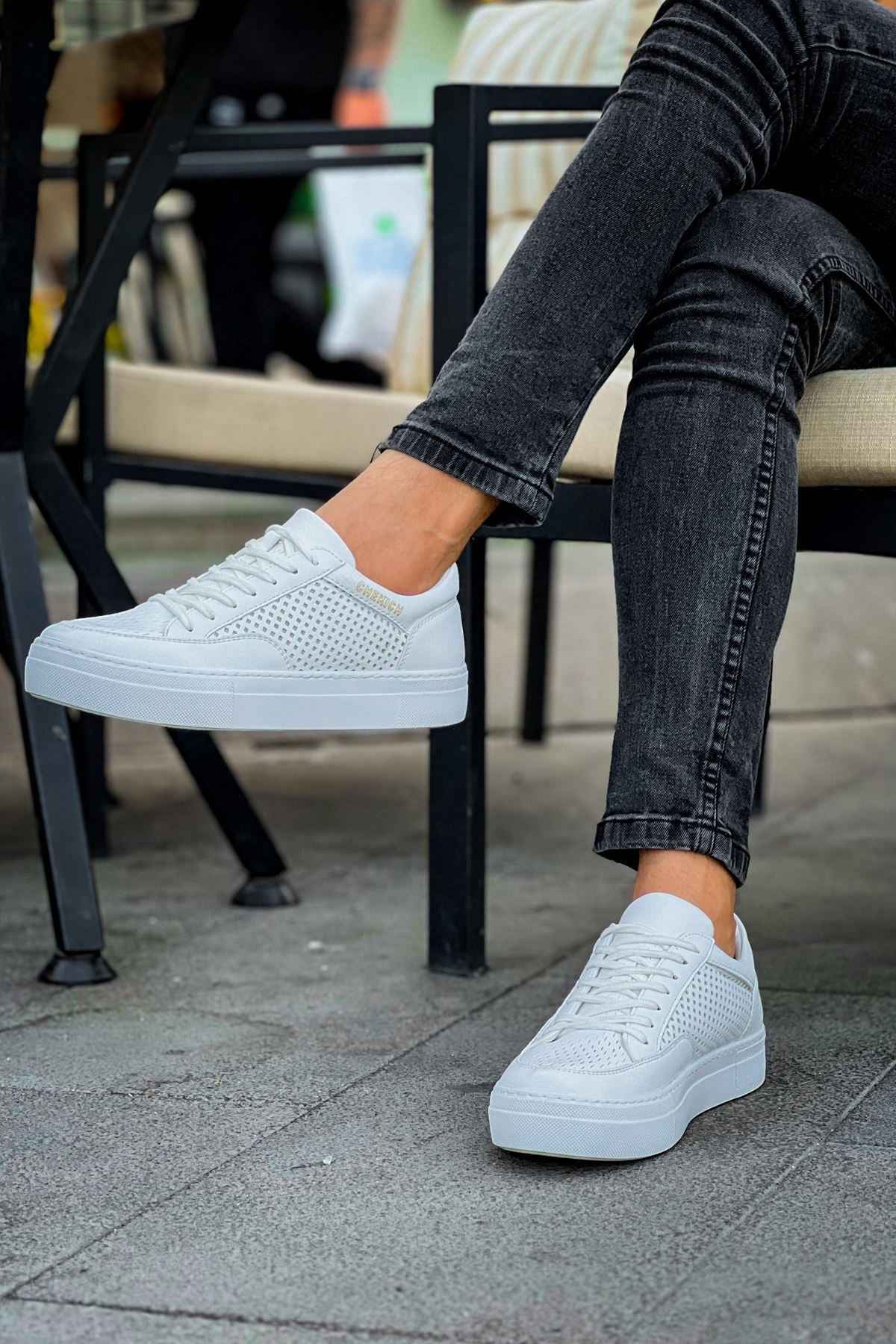 White lace-up sneakers with textured perforated panels