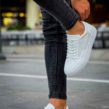 White sneakers with perforated sides and cupsole rubber sole