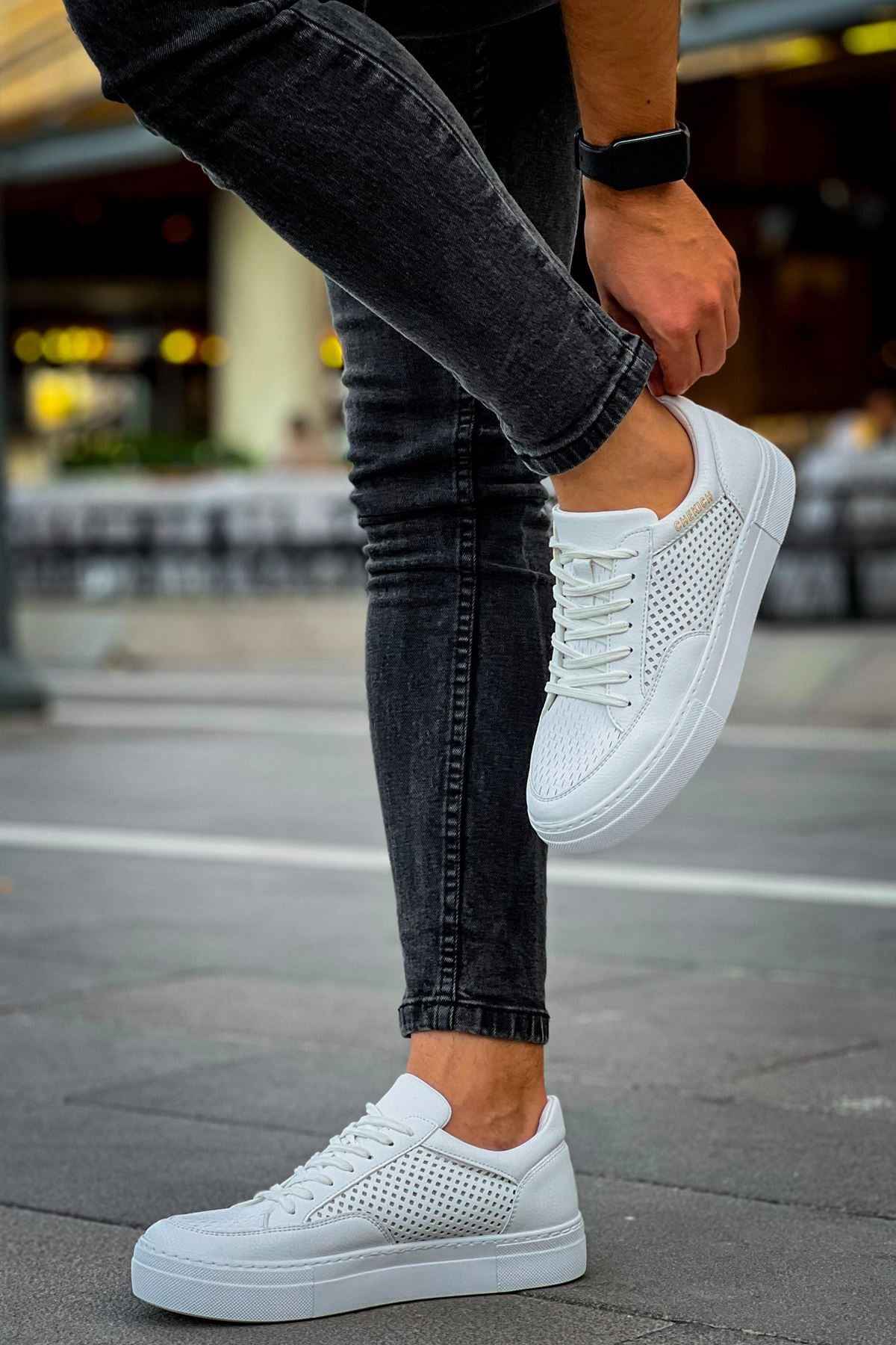 White sneakers with perforated sides and cupsole rubber sole