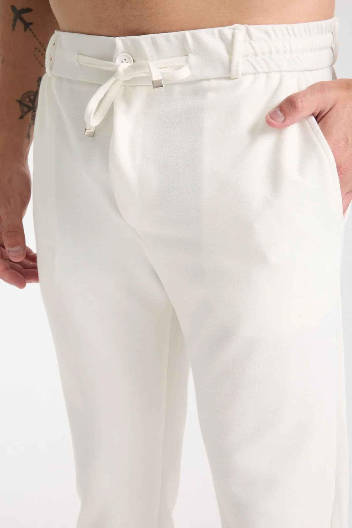 Men's Kaphone sweatpants in white with knotted drawstring and elastic waistband