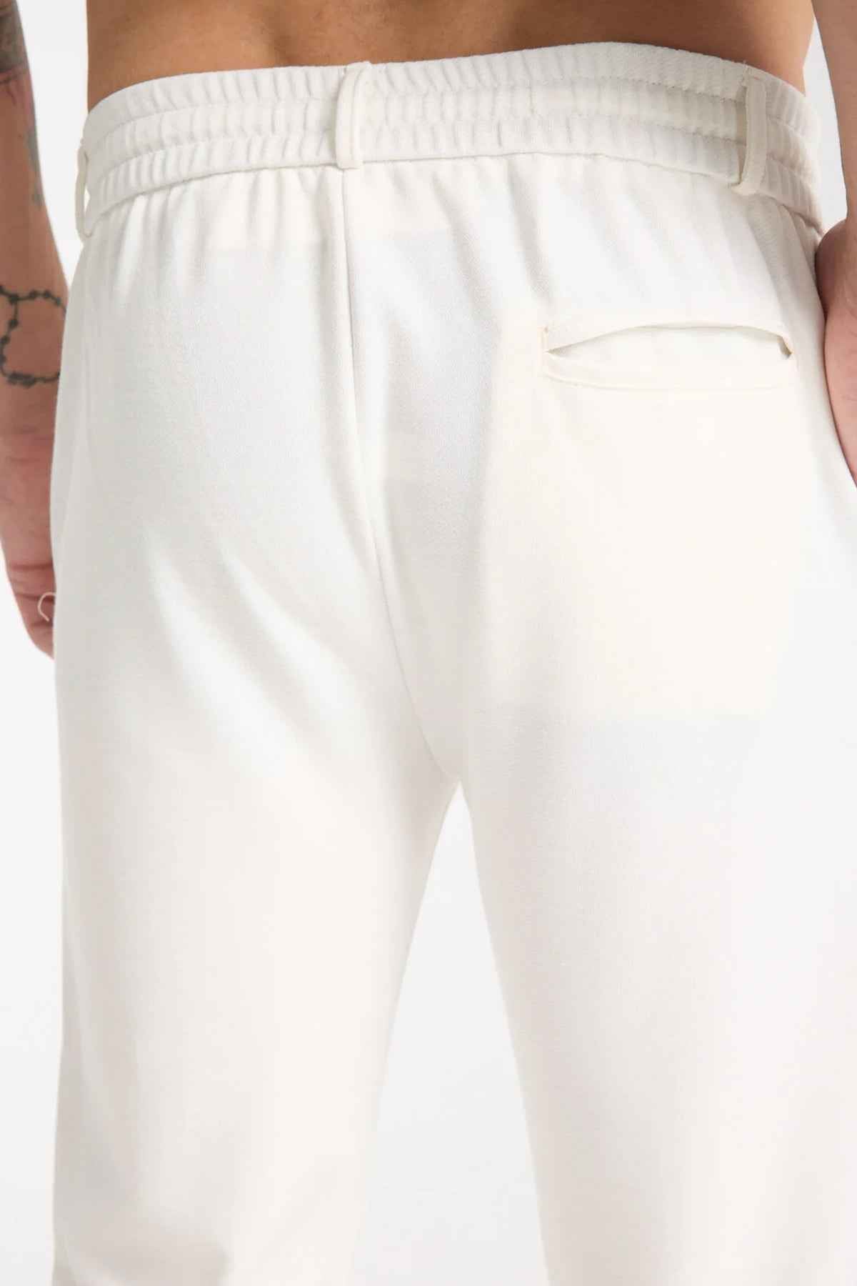 Men's Kaphone sweatpants in white with ribbed elastic waistband and side pockets
