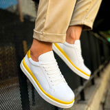 Men's white lace-up sneakers with yellow stripe, angled side view