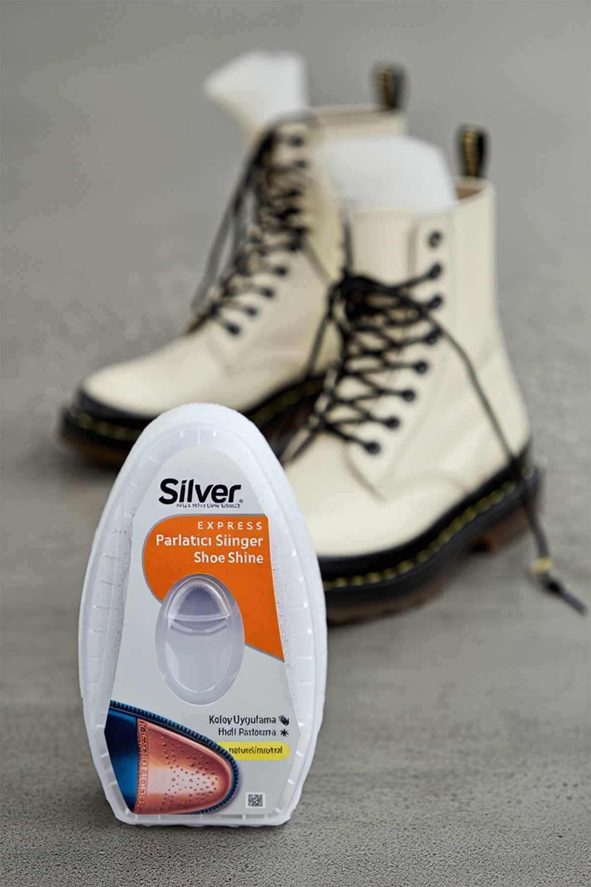 Shoe shine sponge for silver shoes in clear blister pack with orange label