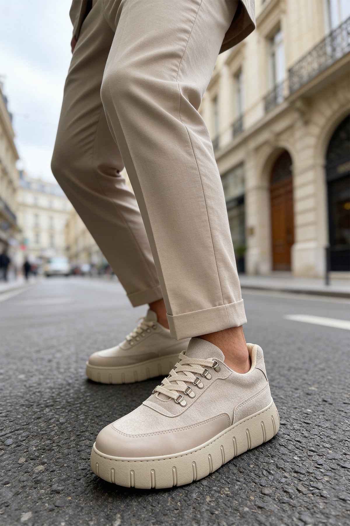 Beige suede sneakers with lace-up closure and thick rubber outsole