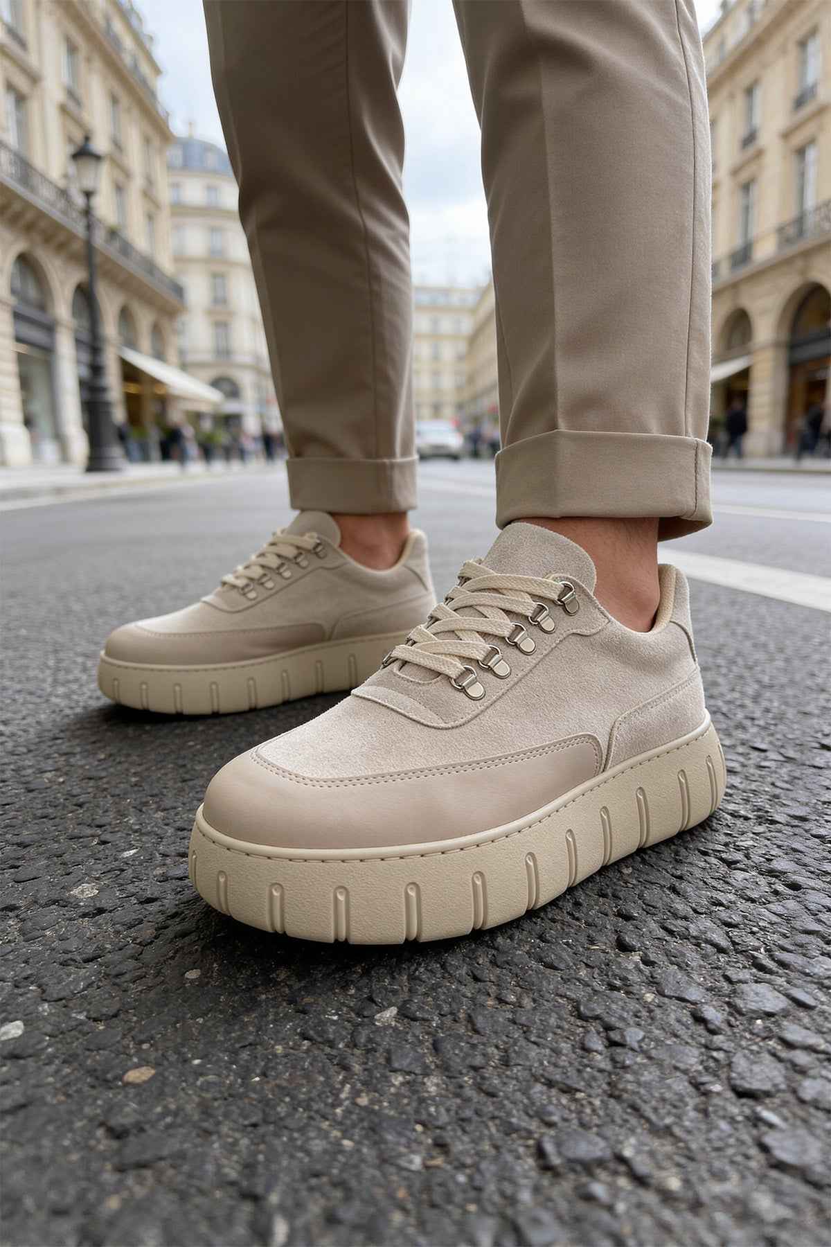 Beige suede sneakers with lace-up front and cushioned rubber sole