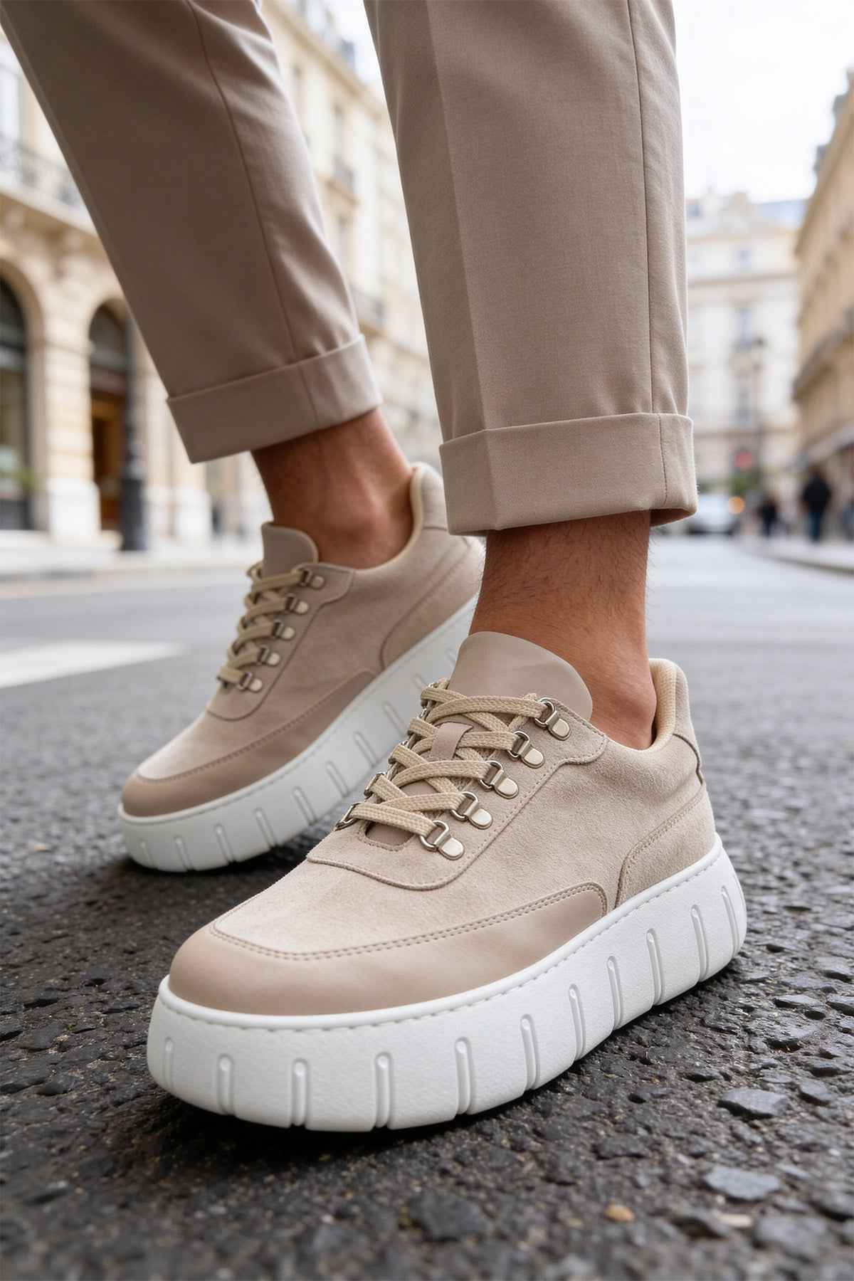 Men's beige suede lace-up sneakers with white cushioned soles and eyelets