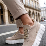 Men's beige suede lace-up sneakers, side view, white sole with tread grooves