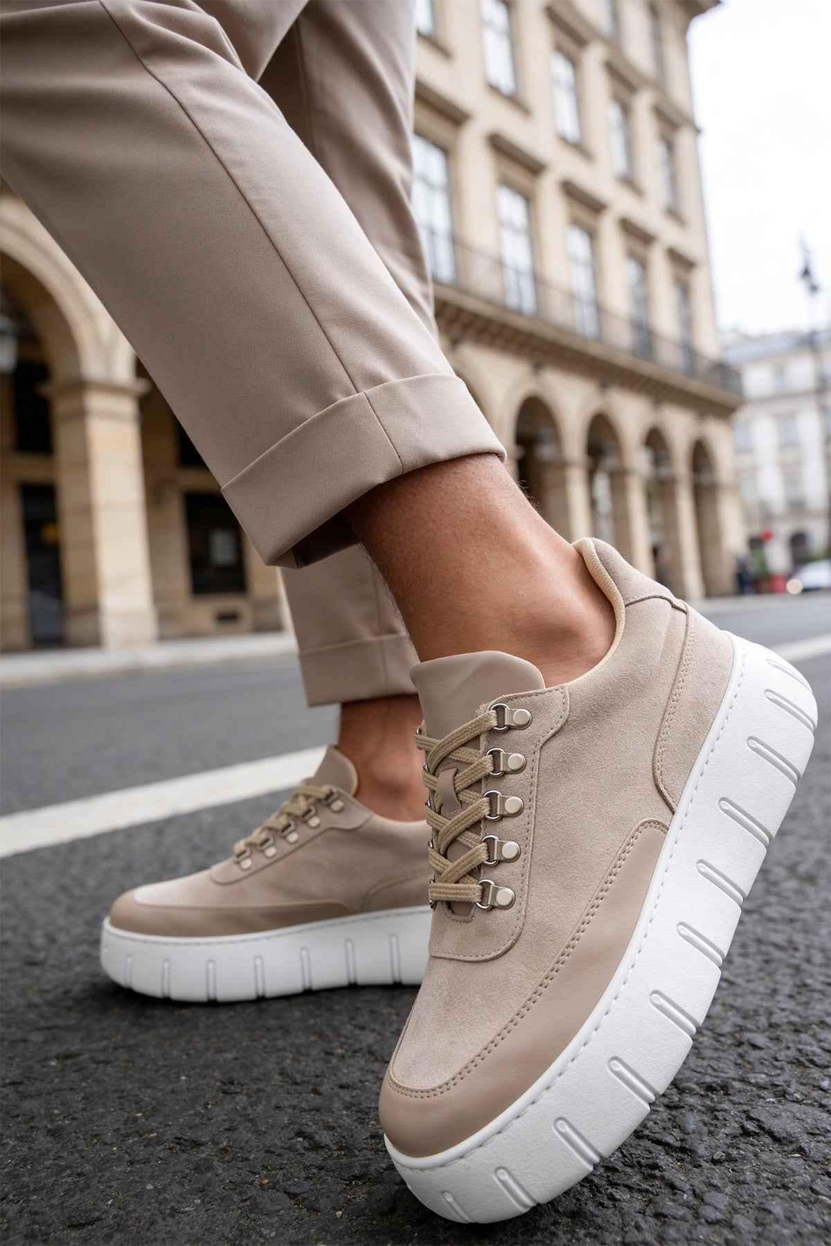 Men's beige suede lace-up sneakers, side view, white sole with tread grooves