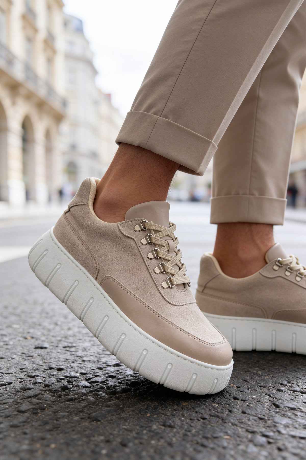 Men's beige suede lace-up sneakers, front angled view, white platform sole