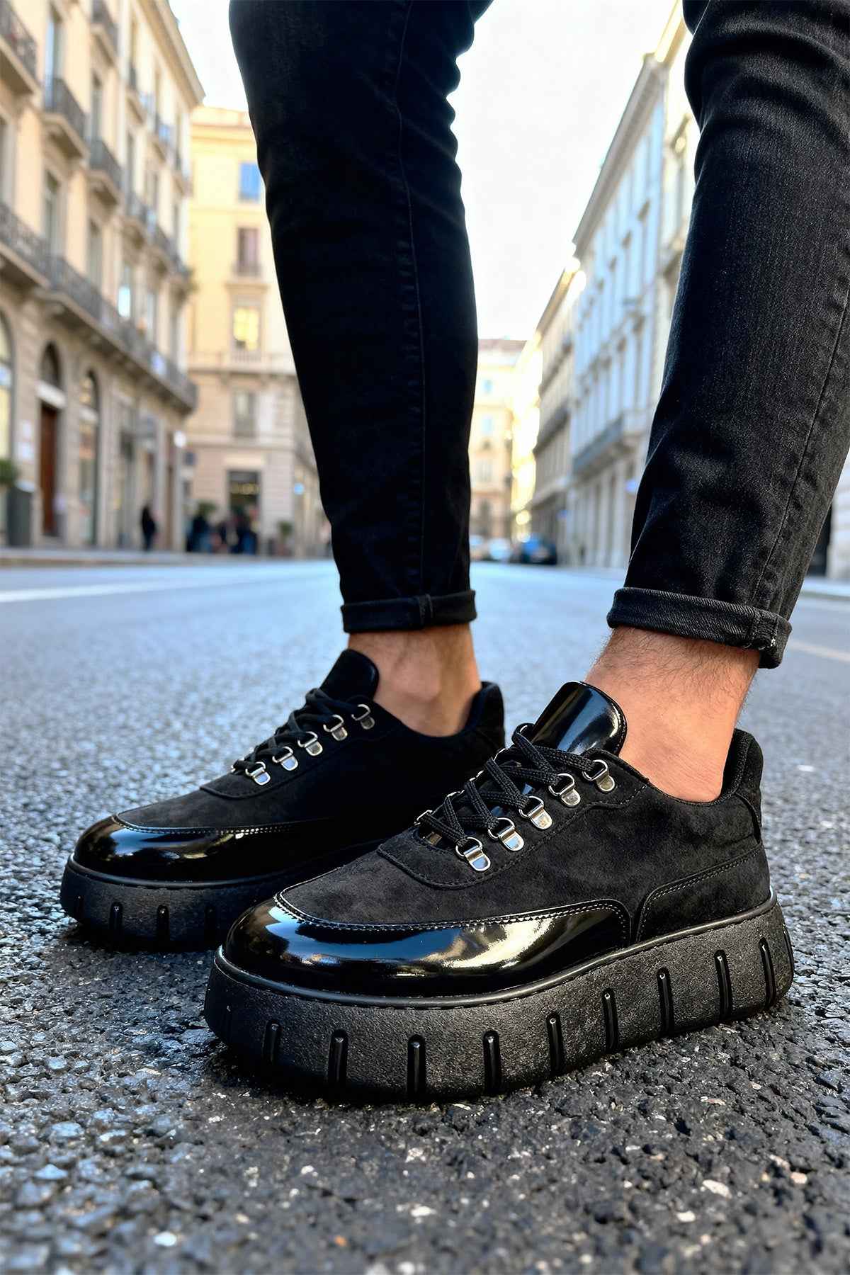 Men's black suede lace-up sneakers with chunky rubber sole, glossy side panel