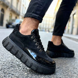 Men's black suede lace-up sneakers with chunky tread sole, side strap detail