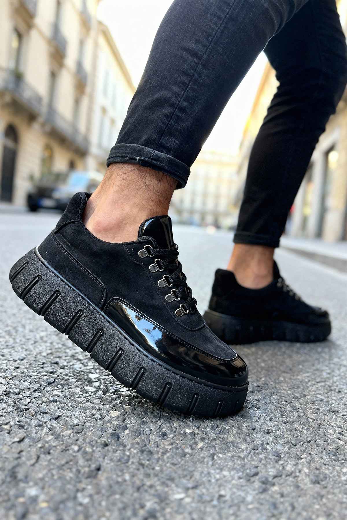 Men's black suede lace-up sneakers with chunky tread sole, side strap detail