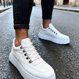 White suede lace-up sneakers with chunky platform sole, side view.