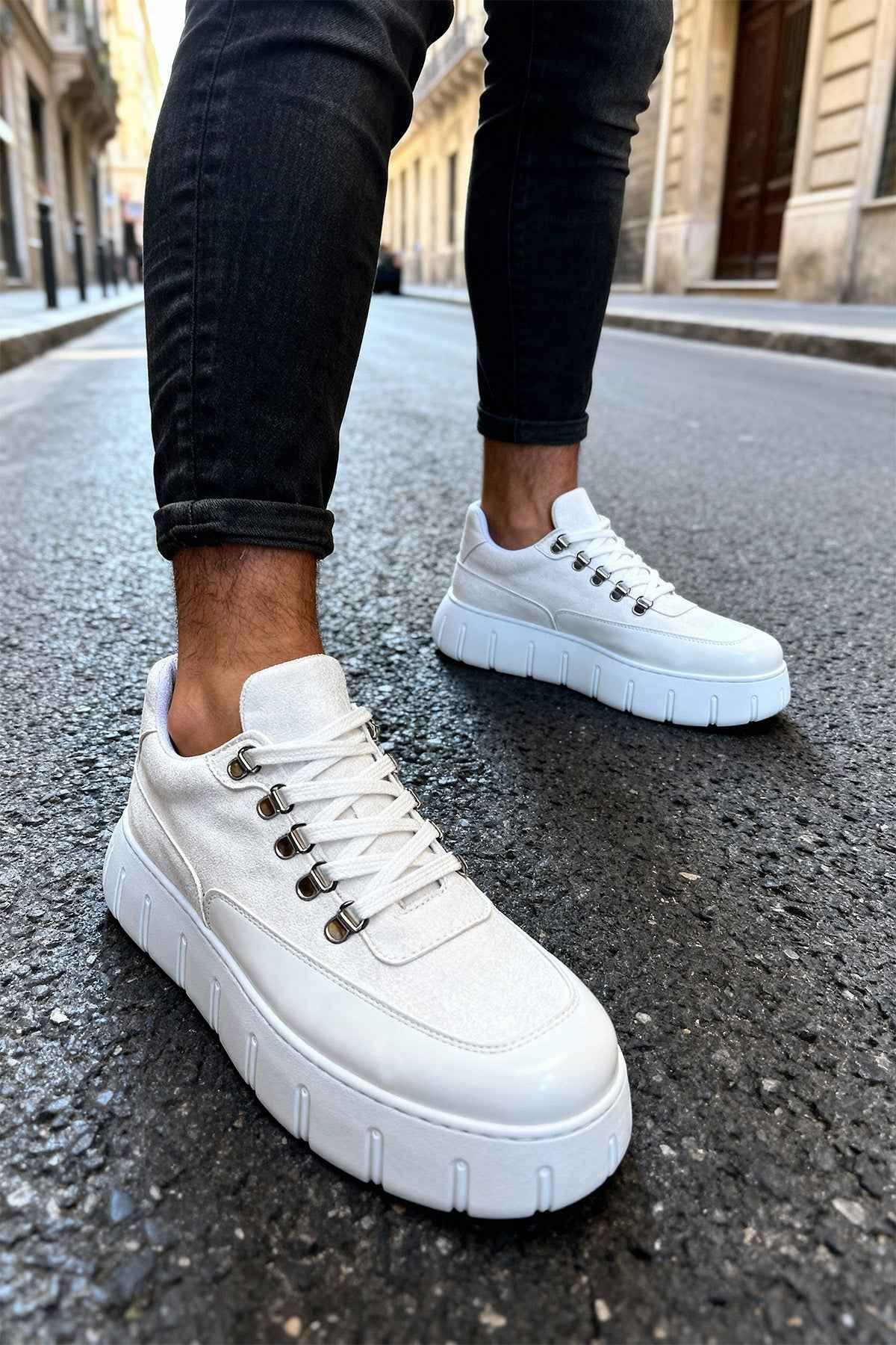 White suede lace-up sneakers with chunky platform sole, side view.