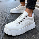White suede lace-up sneakers with thick sole, angled side view.
