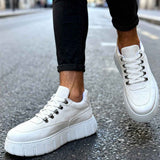 White suede lace-up sneakers with thick textured sole, front side view.